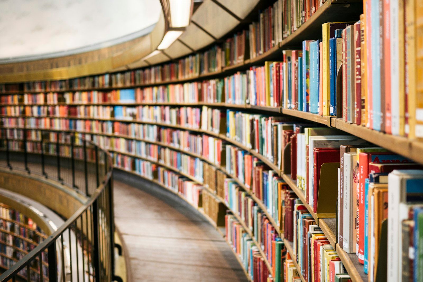 Curved library bookshelves filled with books