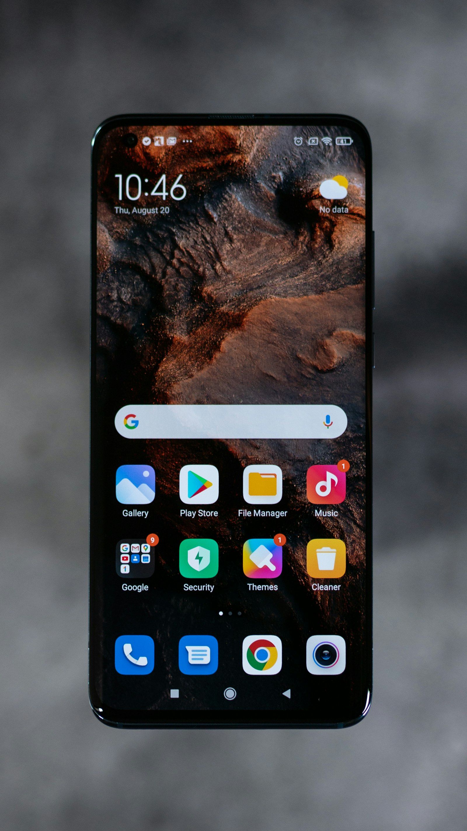 Android smartphone home screen in hand